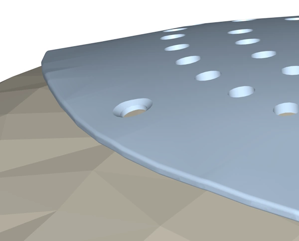 A side on view of a skull cap model showing that sharp edges have been replace by smoothly blended edges.